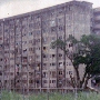 A run down high rise apartment building.